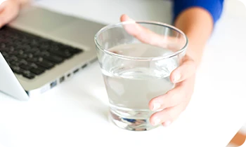 Person holding glass of clean, pure water